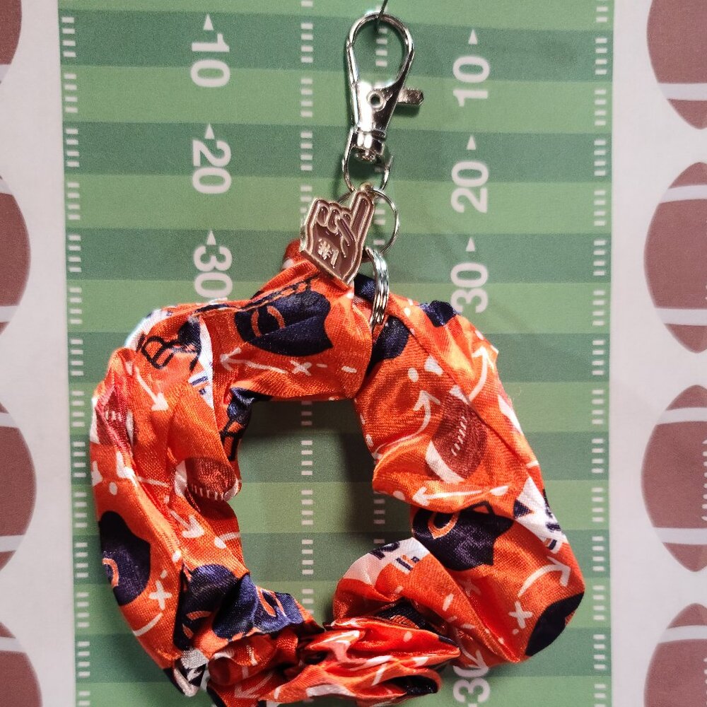 Football Themed Wristlet Keyring with a Football related charm attached !!